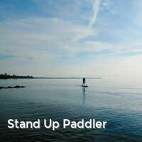 Stand Up Paddler, Strand im Sommer